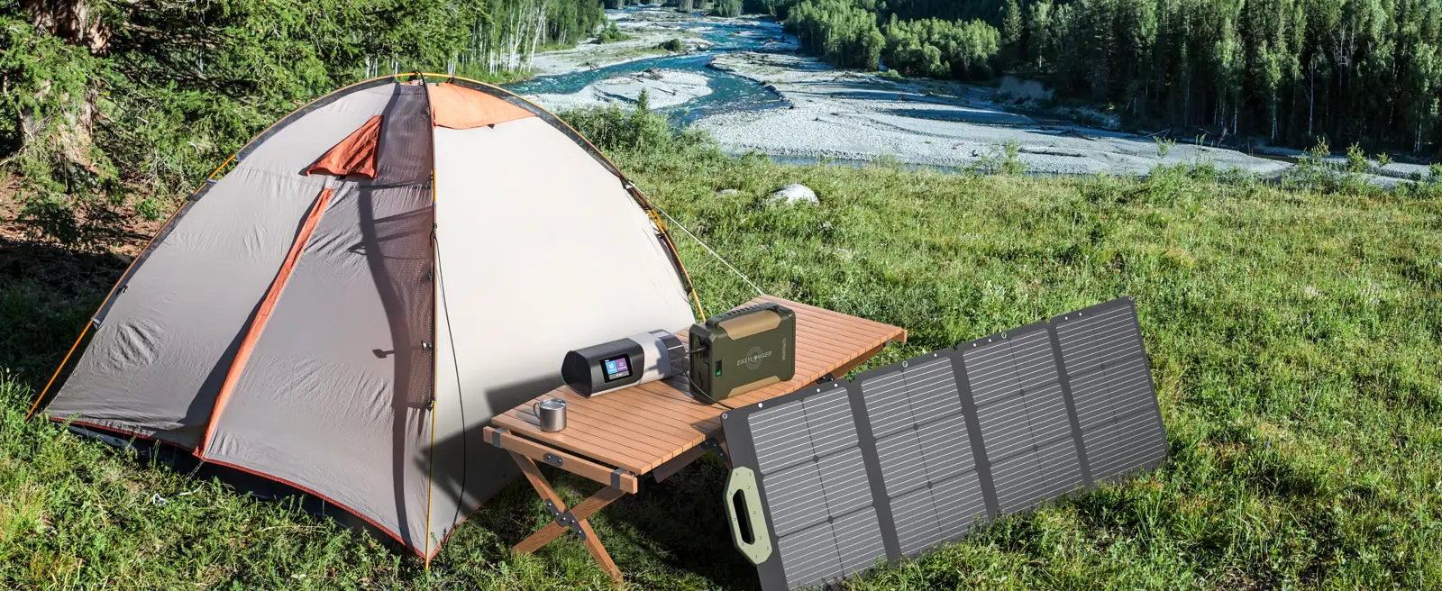 An ES960 charging from a solar panel outside a tent