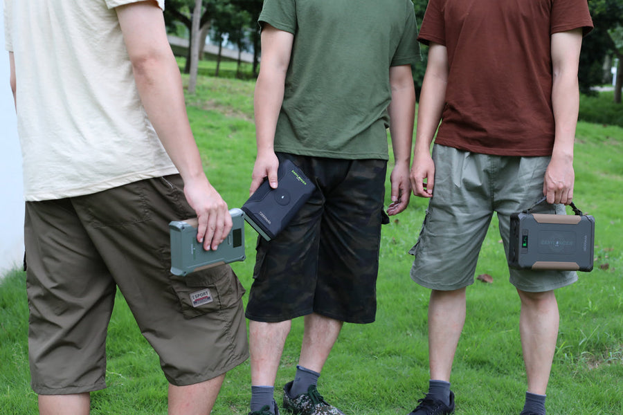Three people outdoors carrying different EASYLONGER battery models