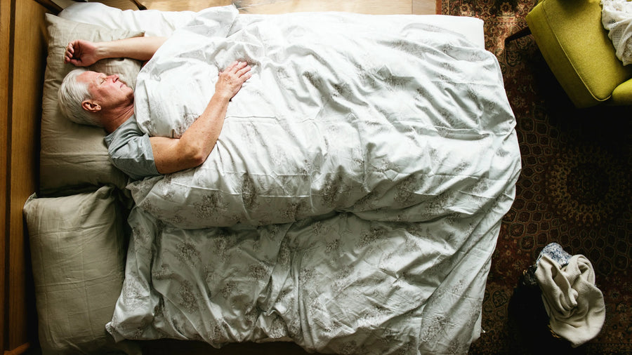 A person sleeping in bed, seen from above
