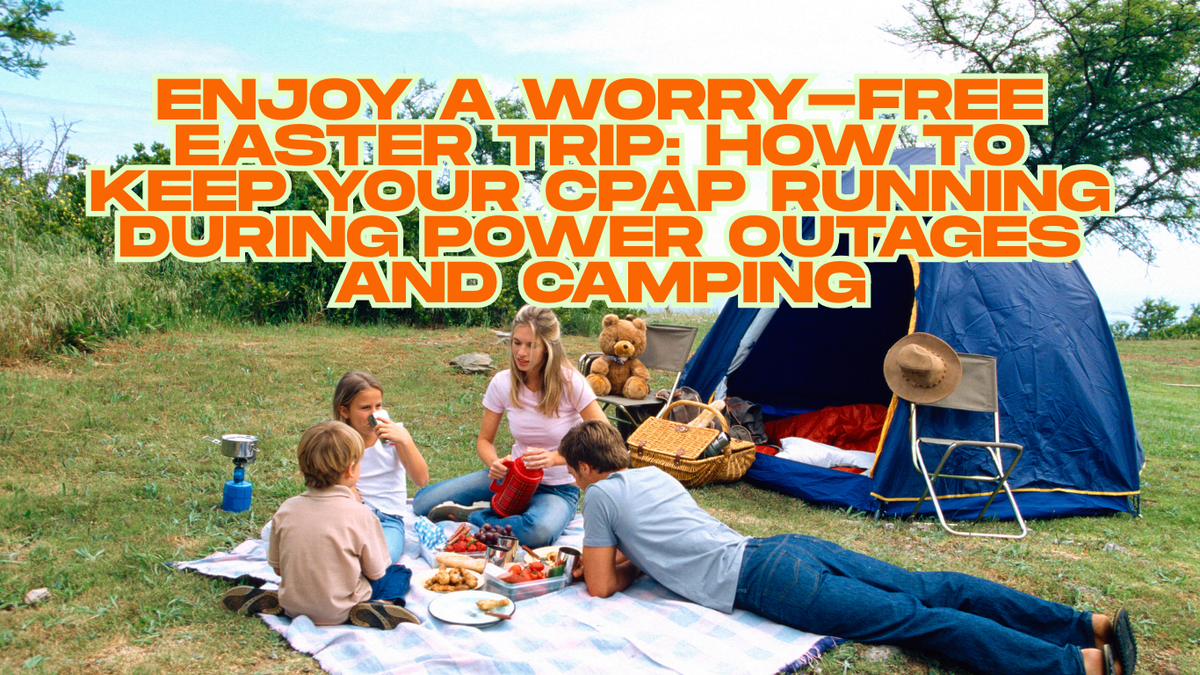 Family picnic on grass near blue camping tent, picnic basket, and stove, outdoor setting