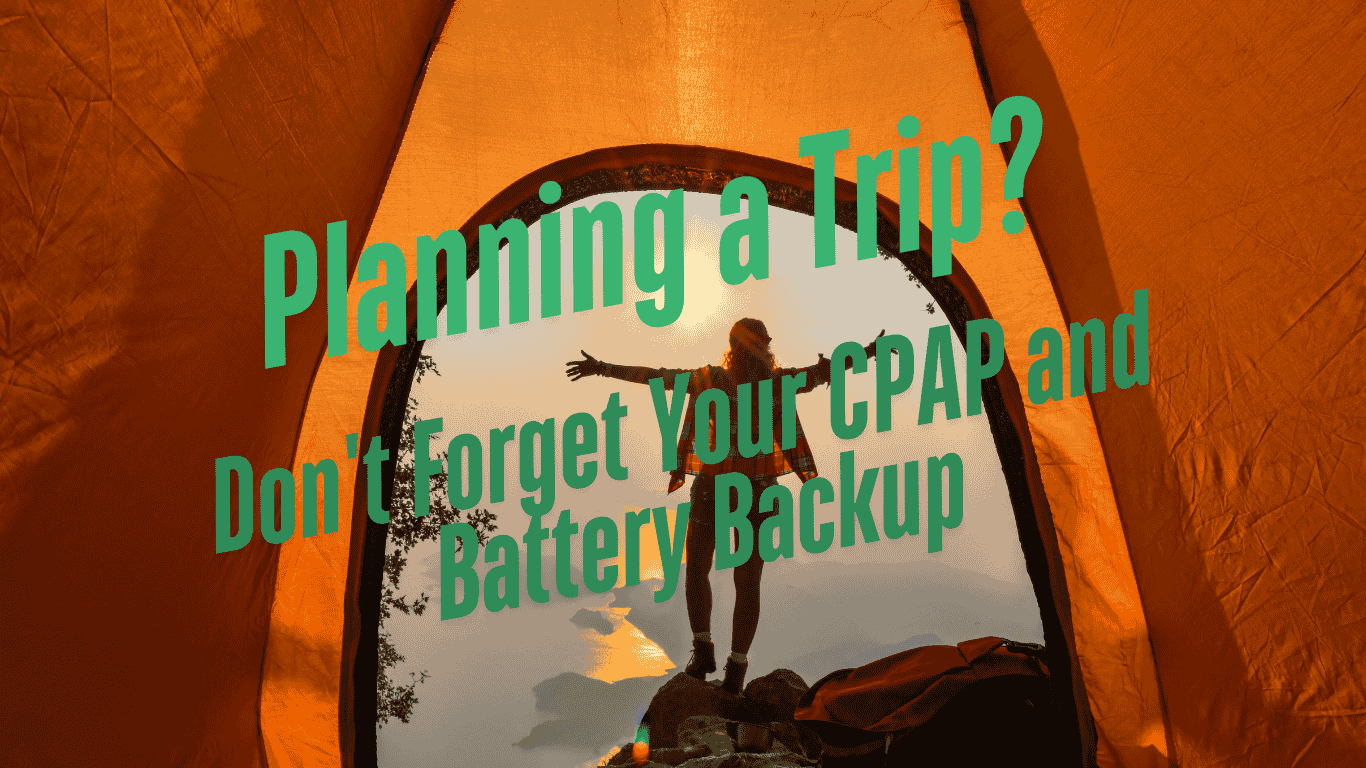 person standing outside orange tent at sunrise, planning a trip, CPAP and battery backup reminder