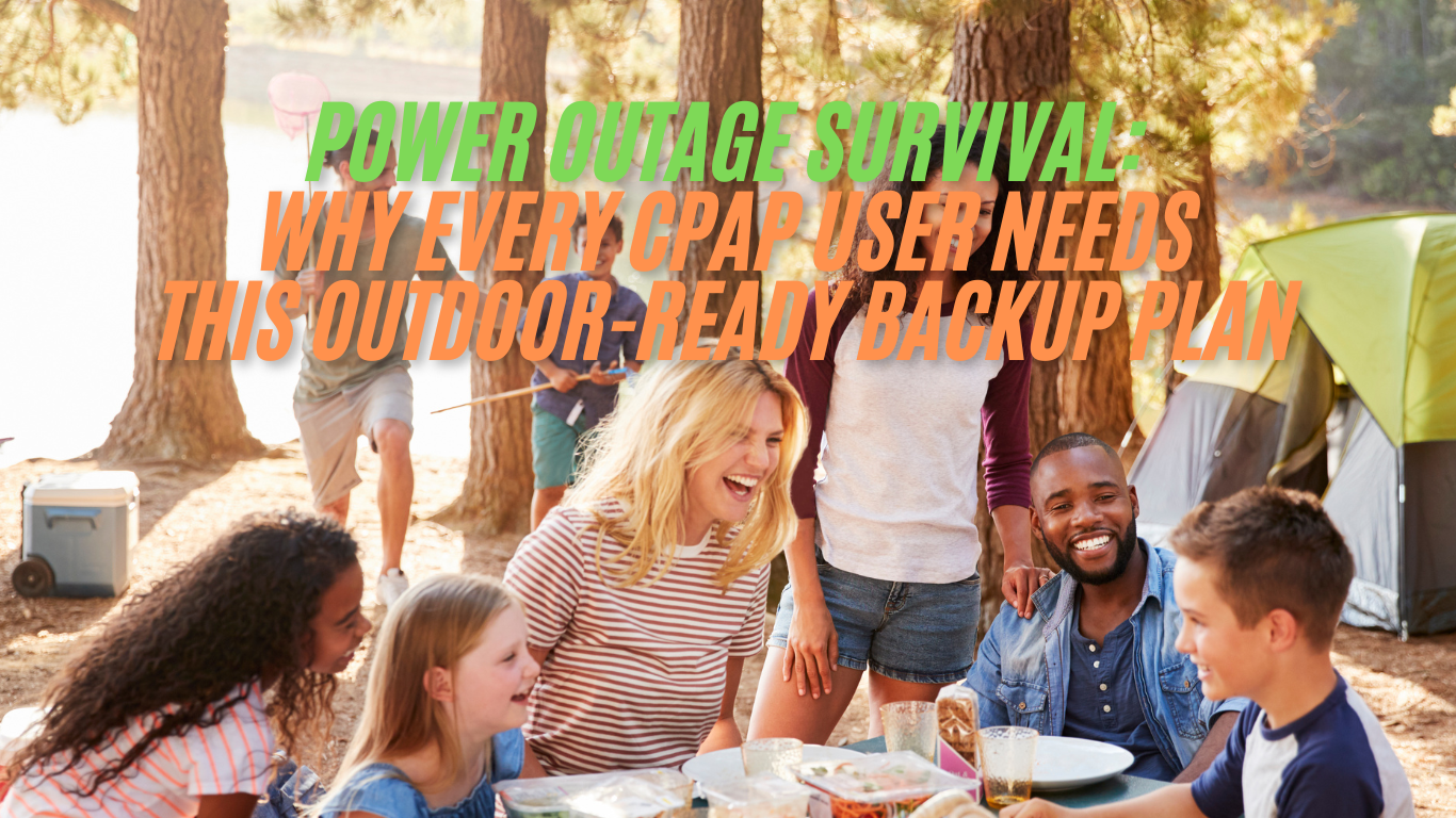 Group of people camping outdoors, smiling at a picnic table with tents and trees in background