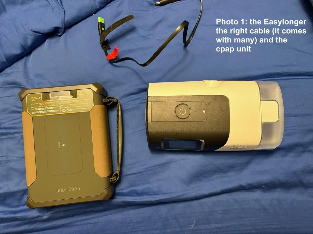 ES960 connected to a CPAP beside a bed before a storm